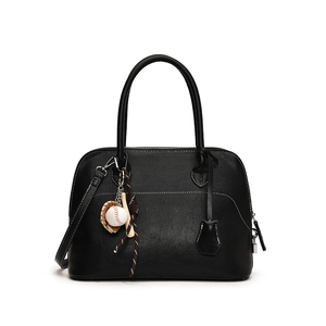 Fashionable black PU leather crossbody handbag with white stitching and baseball charm