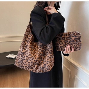 Detailed view of leopard print tote bag and matching pouch in high-quality suede fabric
