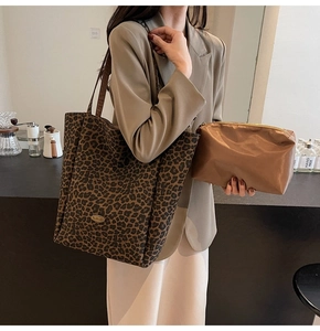 Detail of leopard print canvas tote bag set with matching brown satin pouch