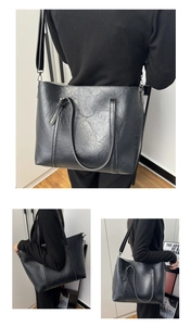 Vue détaillée du sac cabas noir en cuir ciré avec grande capacité et bandoulière réglable