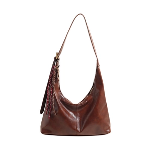 Dark brown oil wax leather hobo bag with braided tassel and adjustable shoulder strap