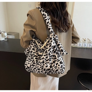 Detail of quilted leopard print tote bag showing large capacity and soft fabric texture