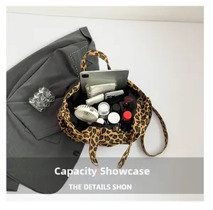 Detail view of large leopard print canvas tote bag showing interior storage capacity