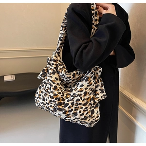 Close-up of leopard print quilted shoulder bag texture and fine stitching detail