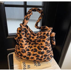 Quilted leopard print handbag with twisted knot handle for casual autumn styling