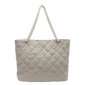 Fashionable quilted tote bag in light beige fabric with durable cotton rope handles