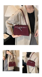 Detail view of burgundy frosted matte handbag with decorative strap buckle and long shoulder strap