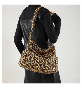Detail of leopard print crossbody bag featuring large capacity and dual front pockets