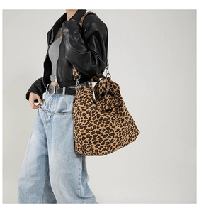 Chic leopard print canvas tote bag styled with a leather jacket for a trendy autumn look