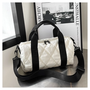 Chic white quilted nylon barrel crossbody bag with black handles and shoulder strap