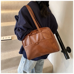 Minimalist brown PU leather shoulder bag showing a classic rectangular design with front pocket