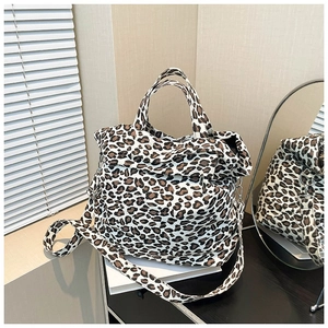 Fashionable leopard print canvas shoulder bag with top handle and adjustable strap