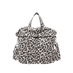 Fashionable leopard print canvas shoulder bag with top handles and adjustable strap