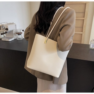 Chic beige lychee textured PU leather tote bag with elegant gold metal strap detail