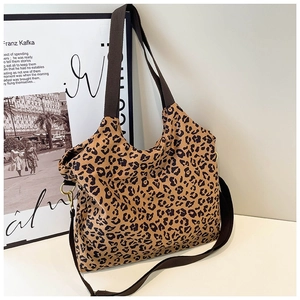 Leopard print canvas tote bag with wide straps and versatile crossbody design