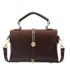 Chic dark brown faux suede and leather handbag with gold metal clasp and crossbody strap
