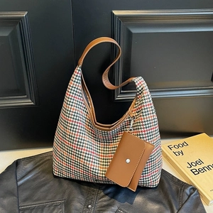 Chic houndstooth wool shoulder bag with brown leather strap and mini coin purse charm