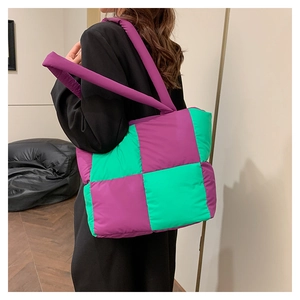Quilted nylon tote bag featuring a purple and green checkered design worn by a model