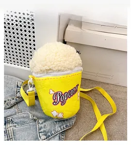 Detailed macro view of the fuzzy popcorn bucket shaped shoulder bag with embroidery
