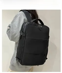 Side view of a black business backpack on a model showing side straps and zipper detail