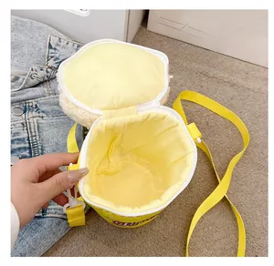 Detail of the yellow plush crossbody bag showing inner lining and spacious interior