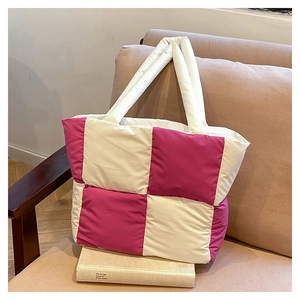 Detail of quilted bubble tote bag with pink and white checkerboard nylon pattern