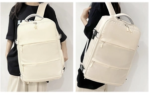 Detail of off-white travel backpack showing waterproof material and multi-pocket layout