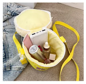 Macro view of bright yellow plush bucket bag interior showing spacious storage capacity