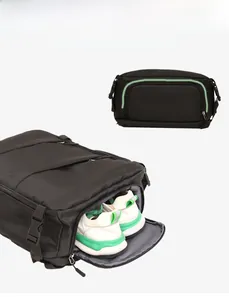 Detail view of the dedicated shoe compartment on a black waterproof travel backpack