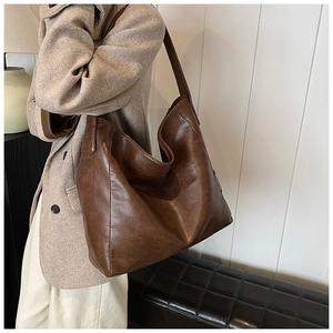 Detailed close-up showing the premium dark brown PU leather texture of this Hobo shoulder bag