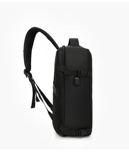 Detail view of black travel backpack with USB charging port and adjustable side buckles