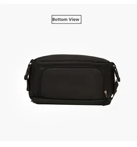 Detailed bottom view of the black travel backpack showing zippers and buckle straps