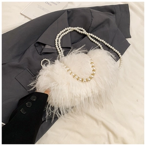Chic white faux fur shoulder bag with elegant pearl chains and rhinestone accents