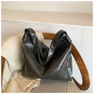 Fashionable dark gray PU leather tote bag with vintage texture and branded ribbon detail