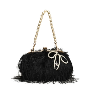 Fashionable black faux fur shoulder bag with elegant pearl handle and bow detail