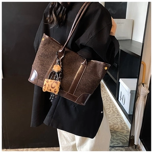Deep brown wool tote bag with leather trim and leopard print plush charm detail