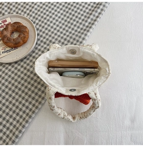 Internal view showing the spacious capacity and magnetic clasp of the floral cotton handbag