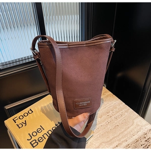 Fashionable dark brown suede bucket shoulder bag with minimalist rectangular design