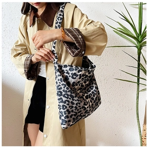 Detailed close-up of high-quality leopard print canvas tote bag for casual styling
