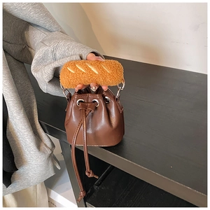 Detailed view of brown PU leather drawstring bucket bag with unique baguette plush handle