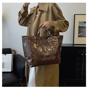 Brown Dupont paper tote bag with vintage crinkle texture and white lettering detail
