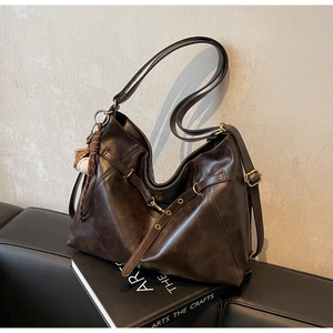 Retro dark brown large PU leather shoulder bag with vintage hardware and baseball pendant
