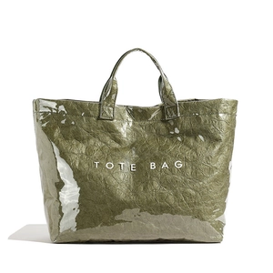 Army green Tyvek tote bag with glossy PVC finish and TOTE BAG print on white background