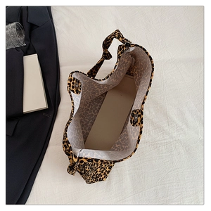 Top view of leopard print canvas tote bag interior showing magnetic buckle closure