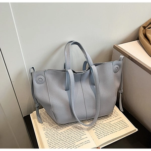 Minimalist light blue PU leather tote bag with lychee texture and decorative drawstring