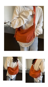 Detail of burnt orange nylon dumpling bag featuring handcrafted woven zipper pull and crossbody strap