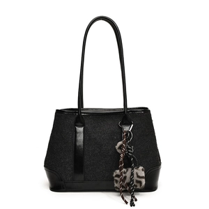 Fashionable black tote bag in autumn design with tweed fabric and leather strap