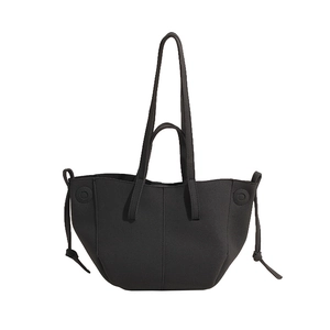 Minimalist black PU leather tote bag with dual handles and side drawstring details