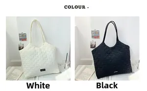 Detail of heart-quilted tote bag texture in black and white minimalist colors