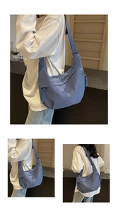 Close-up of fog blue crescent dumpling bag showing durable fabric and adjustable strap
